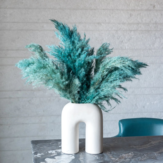 Ocean Blue pampas in a White U Shaped Vase