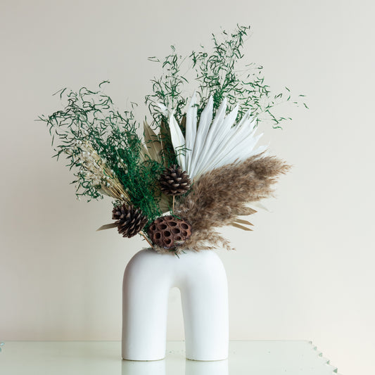 Wild Forest Bunch in a White U Shaped Vase