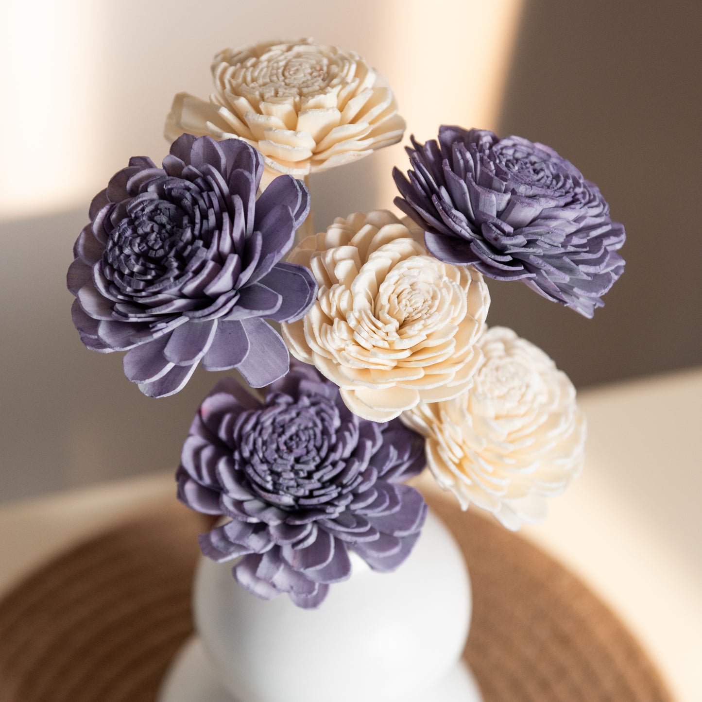 Lavender and White Sola Flowers In a Double Layered Orb Vase
