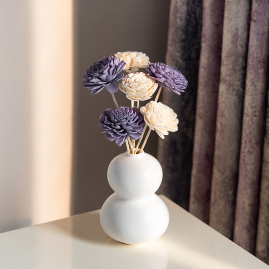 Lavender and White Sola Flowers In a Double Layered Orb Vase