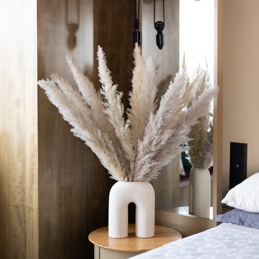 Glow pampas in a White U Shaped Vase